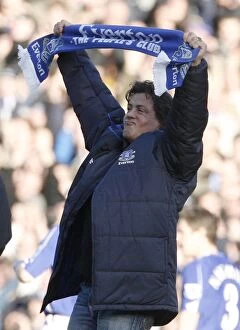 Everton v Reading Collection: U.S. actor Stallone holds a scarf as he walks on the pitch at the English Premier League match betwe
