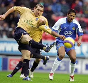 Alan Stubbs Prints: Wigan Athletic v Everton - Alan Stubbs and Antonio Valencia