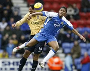 Joleon Lescott Collection: Wigan Athletics Valencia challenges Evertons Lescott for the ball during their English Premier Lea