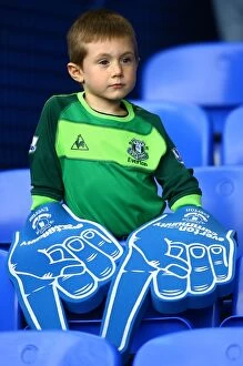 Images Dated 30th October 2010: Young Everton Fan's Thrill: Giant Foam Hands at Packed Goodison Park before Everton vs Stoke City